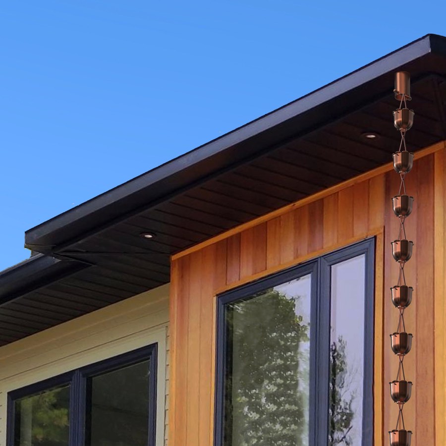 Copper rain chain installed on a modern gutter